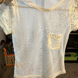 Off white shear small top, jrs small lace sleeves and front pocket, brand new